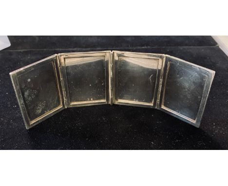 A silver pocket/travelling folding four section photograph frame, with engine turned decoration, 6 cm highoverall condition g