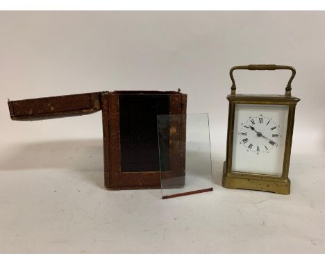 A carriage clock, the 6.5 cm wide enamel dial with Roman numerals, fitted an eight day movement striking on a gong, in a bras