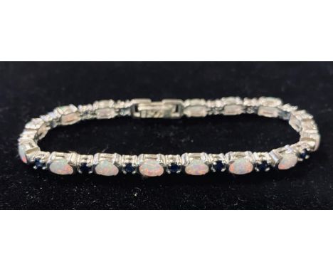 A silver sapphire and opal line braceletModern 