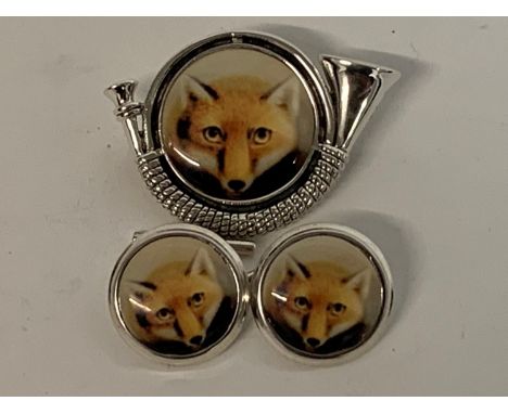 A pair of silver fox enamel cufflinks, and a horn brooch 