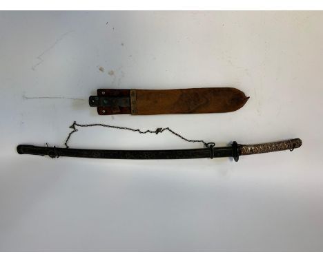 A World War II period Japanese katana sword, in a metal scabbard, 96 cm, and a machete (2)Provenance: both of these items wer