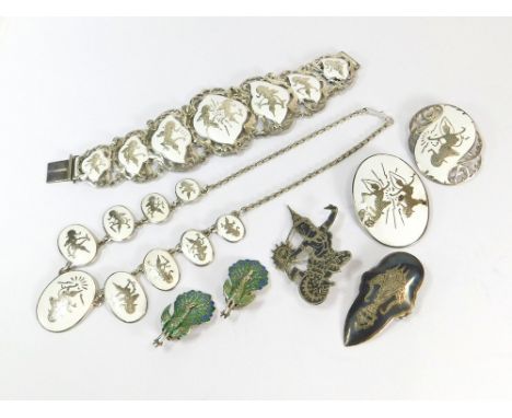 SIAM SILVER. Four pieces of Siam white enamelled silver. (One brooch with enamel loss). Also, a pair of Siam silver enamelled