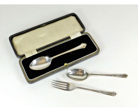 CASED SPOON ETC. A cased silver Christening spoon & a child's silver spoon & fork set, without case.  Please note that all it