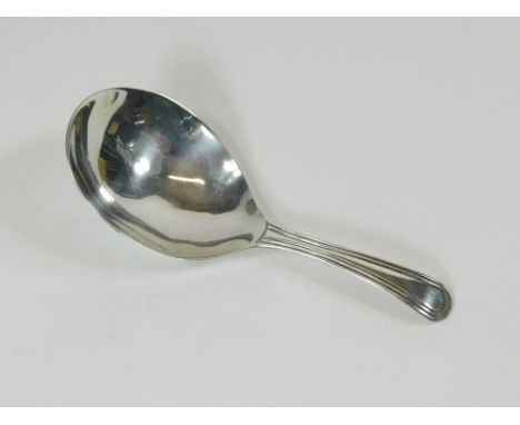 CADDY SPOON. A George III caddy spoon with maker's mark ML. Length 9cm. London 1800.  Please note that all items in this auct