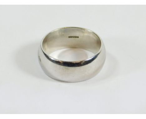 GOLD BAND. A 9ct. white gold, broad band. Size R. Approx. 10.1g.  Please note that all items in this auction are previously o