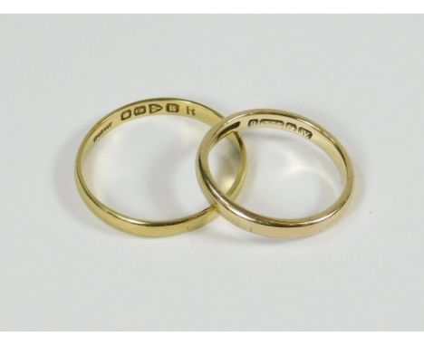 WEDDING BANDS. A 9ct. gold wedding band, Size K. Also an 18ct. gold wedding band, Size Q.  Please note that all items in this