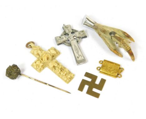 CROSSES ETC. An antique engraved white metal Celtic cross & a carved ivory cross. Also, a bird claw brooch, a stick pin etc. 