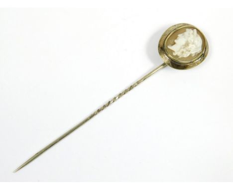 STICK PIN. A Victorian stick pin set a carved shell cameo. Length 9cm.  Please note that all items in this auction are previo