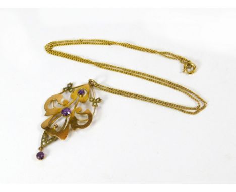 GOLD PENDANT. An Edwardian, 9ct. gold pendant set with amethyst & split pearls, on a 9ct. gold chain. Length of pendant drop 
