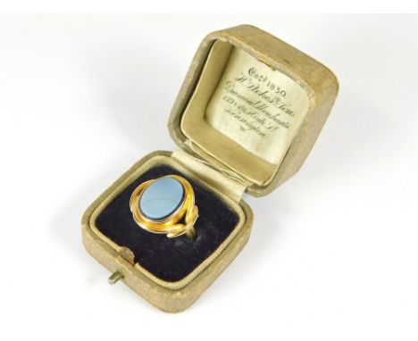 GOLD RING. A gentleman's 19th century gold ring (indistinctly marked but probably 18ct. gold). The front set a sardonyx (with