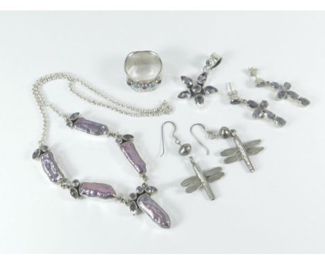 PEARL NECKLACE ETC. A silver necklace set with dyed mother of pearl & purple paste. Also, a hammered silver ring set with ame