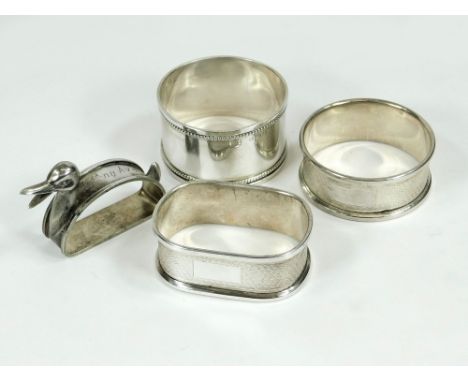 NAPKIN RINGS. Two modern engine turned napkin rings & a beaded silver napkin ring. Also, a Portuguese novelty silver plated n