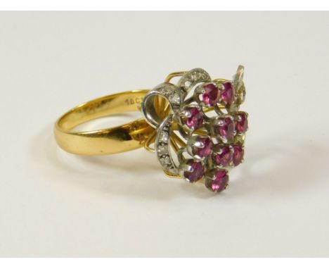 COCKTAIL RING. An 18ct. yellow & white gold cocktail ring, set with rubies & diamonds. Approx. 6.5g. Size K/L.  Please note t