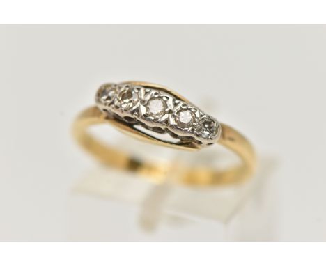 A YELLOW METAL DIAMOND FIVE STONE RING, set with graduating single cut diamonds, to the plain polished band, estimated total 