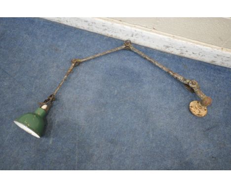 AN EARLY 20TH CENTURY INDUSTRIAL ARTICULATING LAMP, stamped 'Dugdills' to base, and two angled joints (condition report: rust
