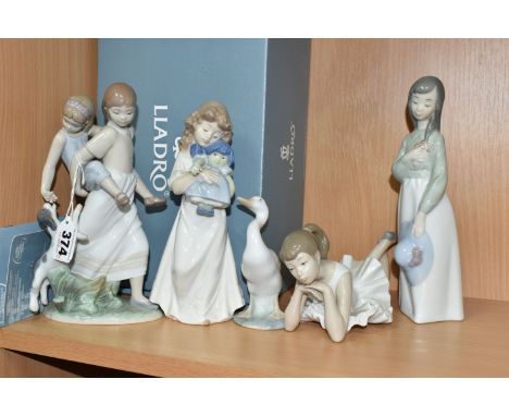 A GROUP LLADRO AND NAO FIGURES, comprising a boxed Lladro 8353 'Oh Happy Days' figure designed by Javier Molina 2008-2017, a 