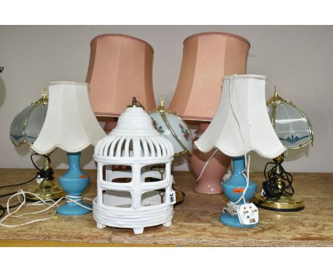 A GROUP OF TABLE LAMPS AND CERAMIC LANTERN, comprising three pairs of table lamps, a single table lamp, and a white glazed ha