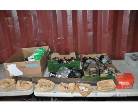 THREE TRAYS CONTAINING MOSTLY TRIUMPH SPITFIRE CAR PARTS including Lucas bake pads and shoes, starter motors, an alternator, 