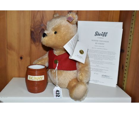 A BOXED LIMITED STEIFF WINNIE THE POOH, 664588, white ear tag and gold button blonde bear, height 25cm, exclusive to Danbury 