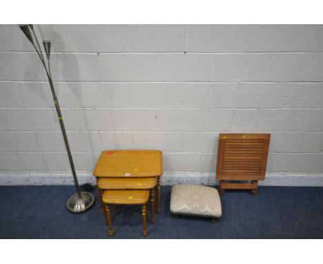 AN OAK EFFECT NEST OF THREE TABLES,  a three branch standard lamp, a footstool and a folding table (condition report: minor m