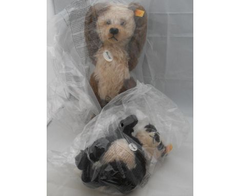 A Steiff Cappuccino Teddy Bear, 33 cm and a Paddy Panda mohair black/white, 20 cm, both retired, in original unopened wrappin