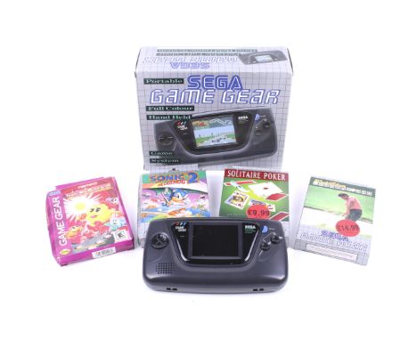 A Sega Game Gear handheld games console. Complete with leaflet, in original box.