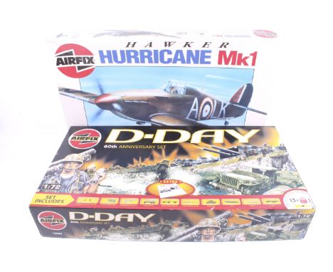 Two Military themed Airfix model kits. Comprising one D-Day Anniversary kit 1:72 scale and one Hawker Hurricane 1:24 scale, b