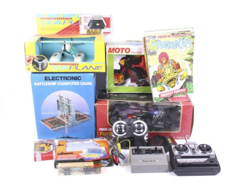A collection of vintage toys and games. Including a remote control buggy, Battleship computer game and battery operated sea p