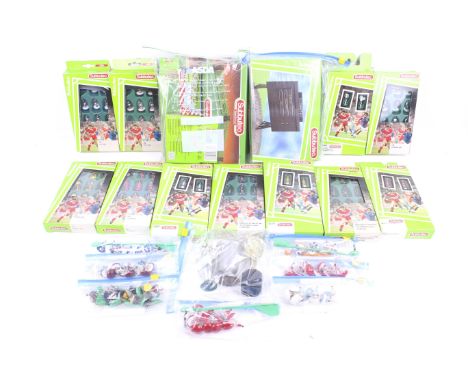 A collection of Subbuteo teams and accessories. Including 11 boxed team sets plus some loose, together with accessories inclu
