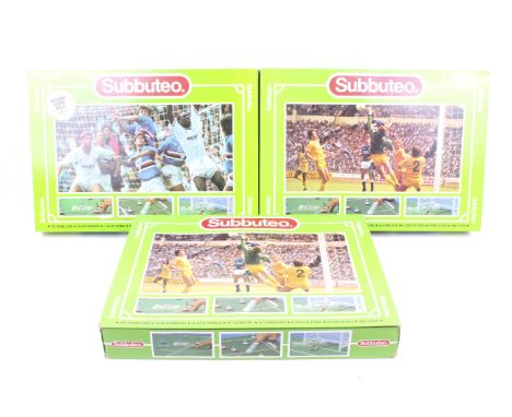 A collection of three Subbuteo table soccer sets. No. 60140, appears complete and in original boxes.
