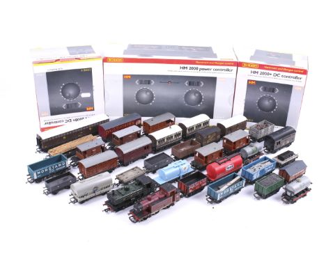 A collection of OO gauge tank engines and goods wagons. Two tank engines including one Bachmann GWR 0-6-0 9643 plus a range o