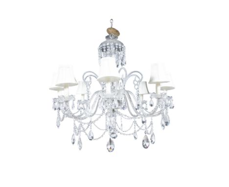 A LARGE CUT-GLASS EIGHT LIGHT CHANDELIER the domed corona hung with rows of cut glass beading, over scroll arm branches, each