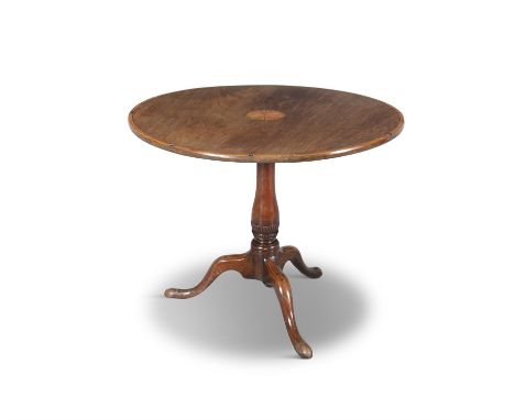 A GEORGE III MAHOGANY AND SATINWOOD BANDED CIRCULAR WINE TABLEthe snap-action top inlaid with a radial sunburst, on a carved 