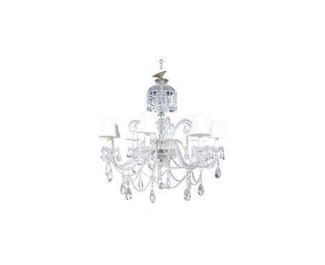 A LARGE CUT-GLASS EIGHT LIGHT CHANDELIER the domed corona hung with rows of cut glass beading, over scroll arm branches, each