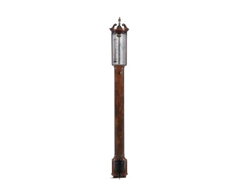 A GEORGE III STICK BAROMETER, EARLY 19TH CENTURY,the mahogany case with broken swan neck pediment and brass urn finial, above