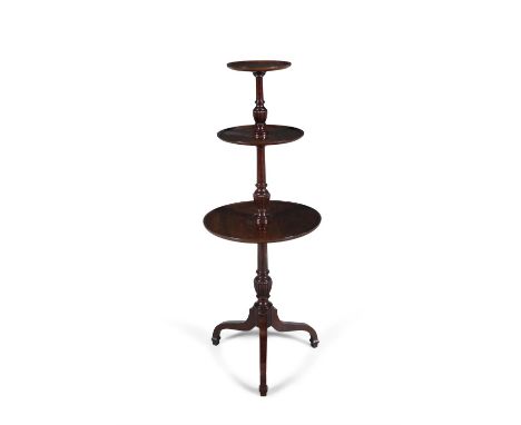 A VICTORIAN MAHOGANY THREE-TIER CIRCULAR DUMBWAITERthe graduated dished platforms joined by a fluted centre column on arched 