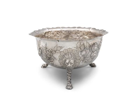 A LATE VICTORIAN IRISH SILVER PUNCH BOWLDublin 1898, mark of West & Sons, in the form of an oversized sugar bowl with repouss