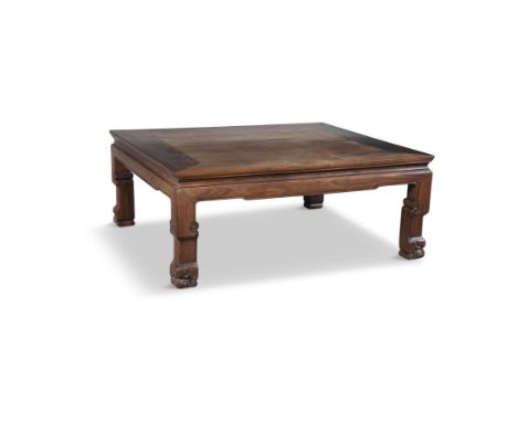 A CHINESE HARDWOOD LOW TABLE, LATE QING DYNASTY,of square form, on short scroll legs with paw feet. 88 x 74 x 35cm high