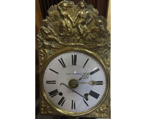 A 19th Century pine cased French long case clock with pokerwork style decoration, the embossed brass movement with white enam