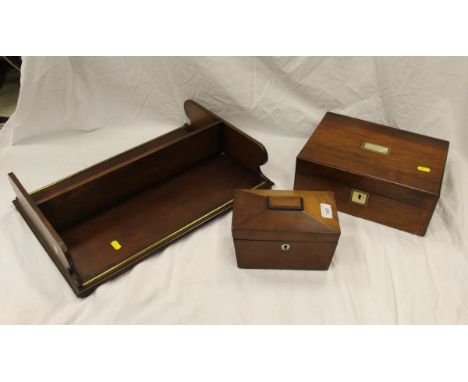 A Victorian rosewood and mother of pearl inlaid writing slope, a Victorian mahogany sarcophagus shaped tea caddy and a mahoga