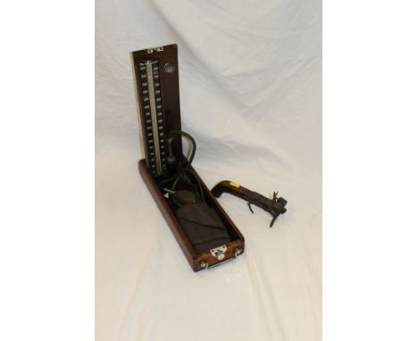 A 19th Century flintlock tinder lighter and a mahogany cased Accoson sphygmomanometer CONDITION REPORTS Tinder lighter does n