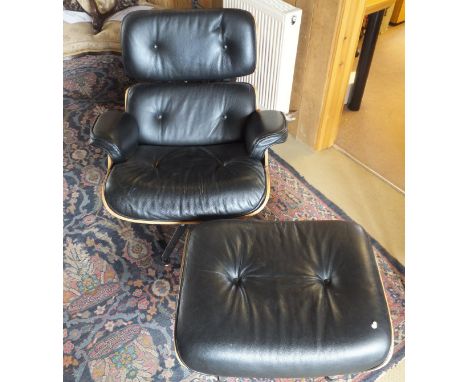 A black leather button back upholstered chair and ottoman in the manner of Charles and Ray Eames, model No. 760 and 761 CONDI