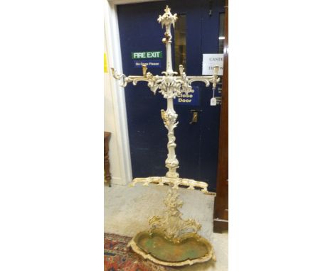 A 19th Century white painted cast iron hall stand in the manner of Coalbrookedale, surmounted by berry on fruit decoration ab