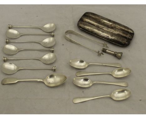 A box containing a set of six Elkington & Co silver spoons, a pair of Isle of Man sugar tongs (Sheffield), together with four