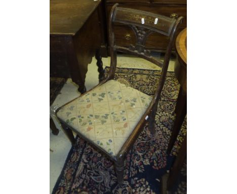 A set of four rosewood and brass inlaid Regency dining chairs, together with a set of four elm seated stick back chairs and a