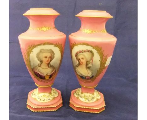 A pair of 19th Century Sevres vases with salmon pink ground and circular medallions, decorated with portrait busts of Marie A