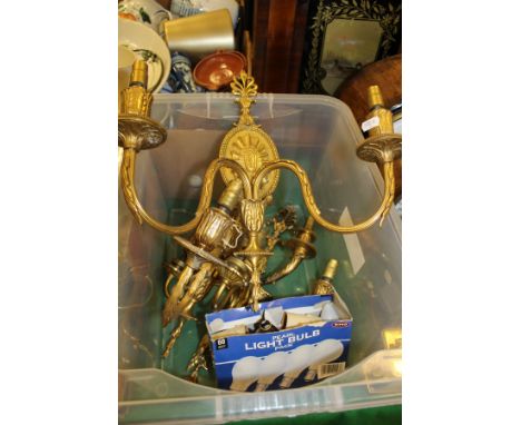 A pair of Regency style brass two light wall sconces and two others similar
