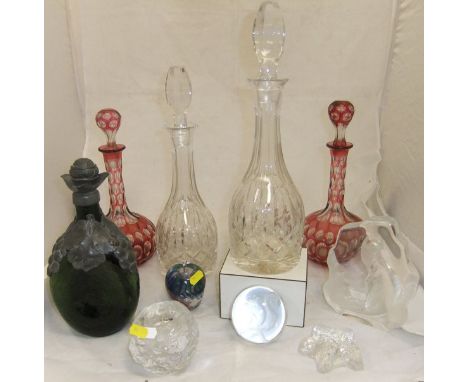 A pair of 19th Century cranberry overlaid cut glass decanters, a pair of clear cut glass decanters of mallet shape with long 