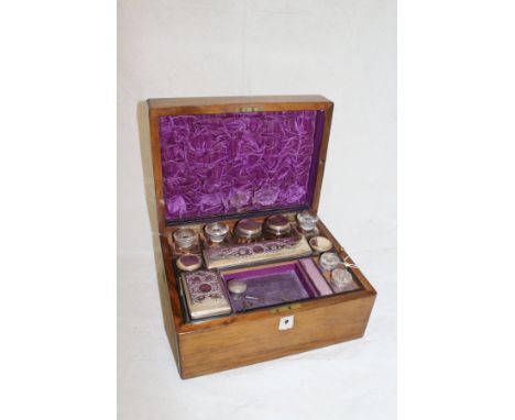 A Victorian walnut cased lady's travelling vanity box with various fittings, together with a silver and amethyst pendant, a 9