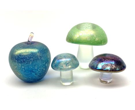Three John Ditchfield Glasform iridescent mushroom paperweights, two with paper labels beneath, largest H9cm, together with a